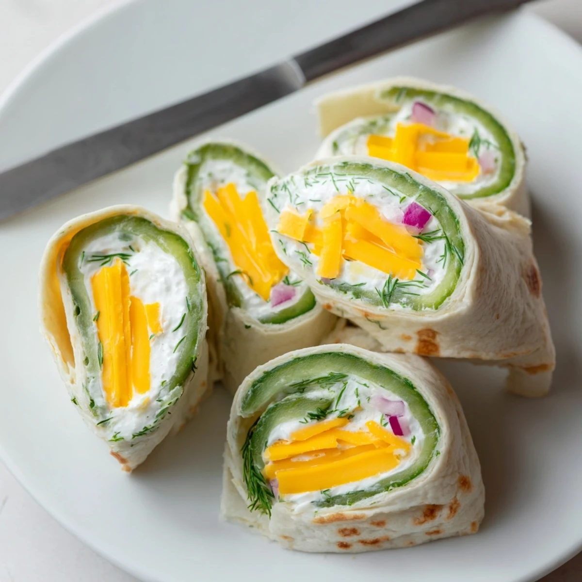 Crispy dill Pickle-in-a-Blanket wrapped in soft tortillas for a tangy bite.