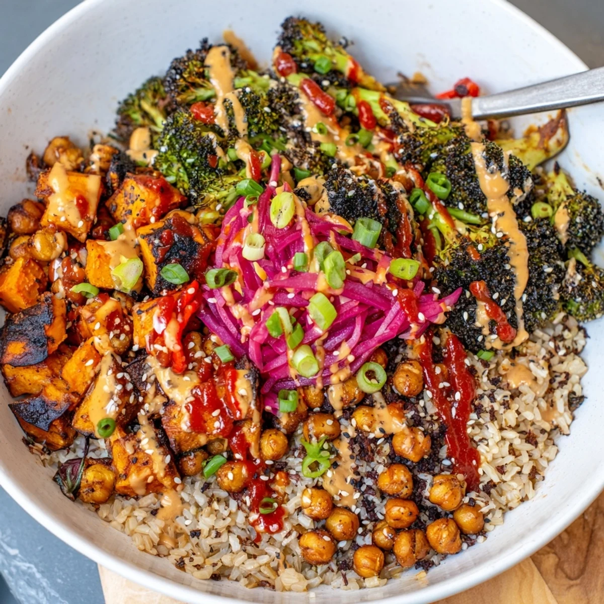 Vibrant Bold Sauce Drizzle Bowls topped with roasted veggies and flavorful sauces.  
