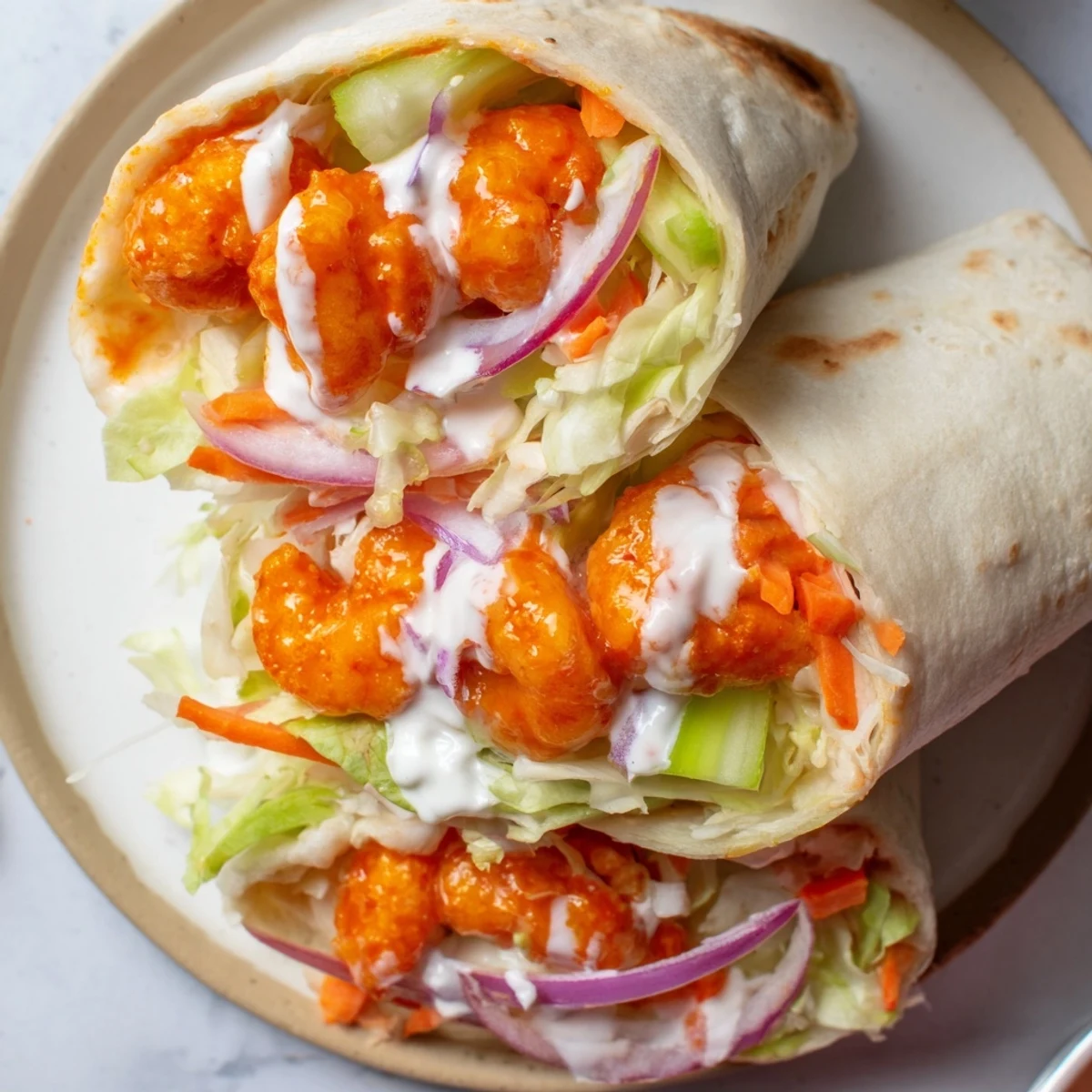 Freshly made buffalo shrimp wraps, featuring juicy shrimp and crisp fillings for a satisfying bite!