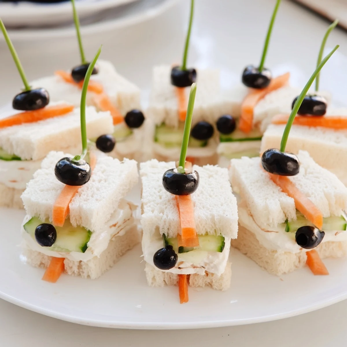 Bee Sandwich cutouts with vibrant fruits, perfect for a cheerful kids' picnic spread.