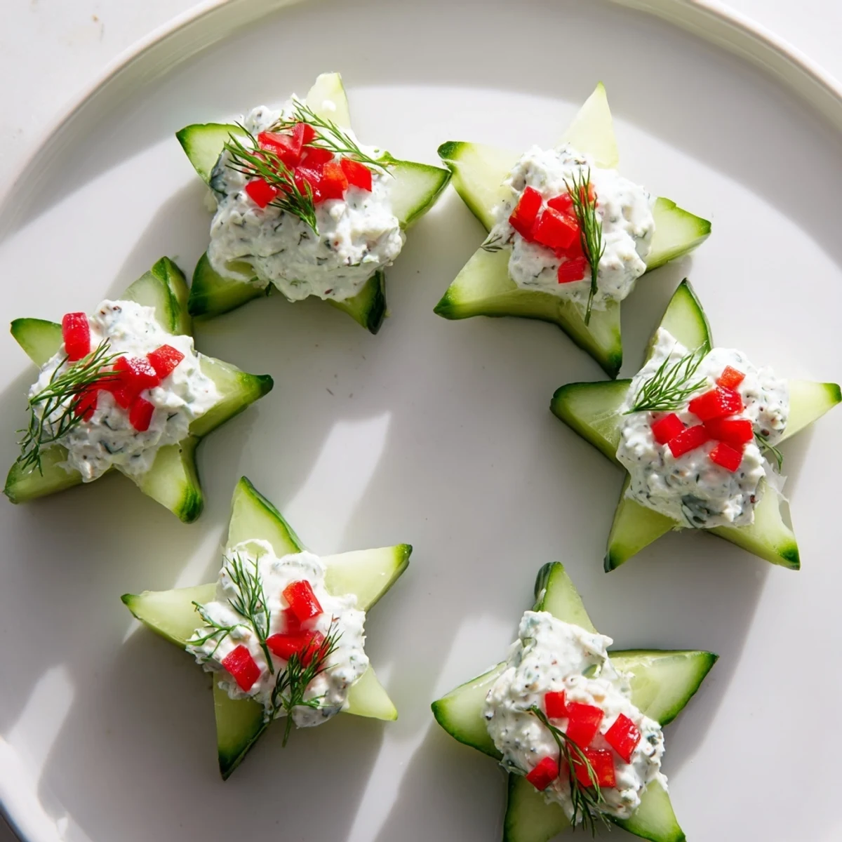 Refreshing Cucumber and Dill Christmas Stars appetizer, showcasing creamy cheese stars with fresh dill garnish.
