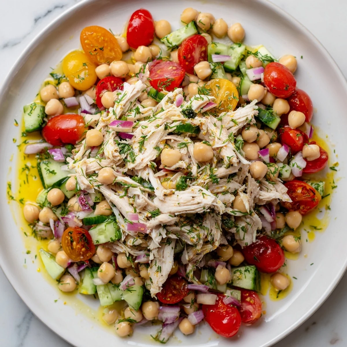 The prepared Dense Bean Salad with Lemon-Dill Chicken is bursting with savory and fresh flavors.