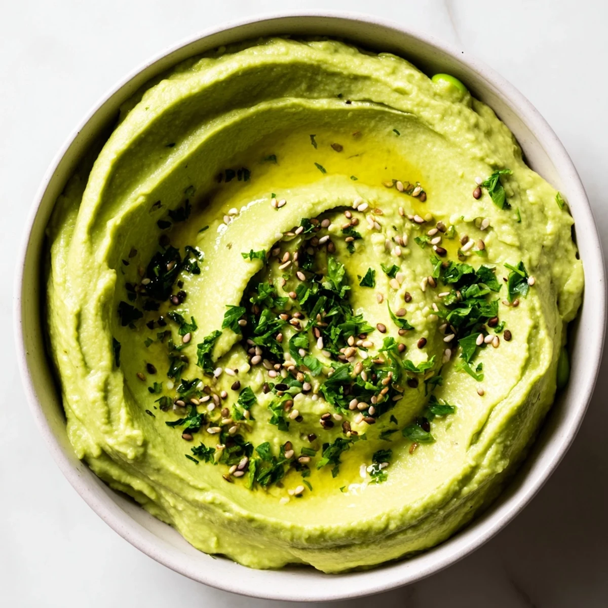Homemade edamame hummus, a healthy and flavorful appetizer perfect for sharing with friends.