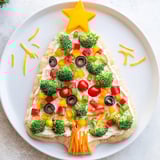 Creamy Easy Christmas Tree Veggie Pizza features a beautiful assortment of fresh, vibrant toppings.
