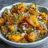 Sweet and fiery mango habanero salsa with diced mango, red onion, and zesty lime juice.