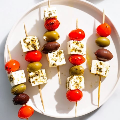 Festive Holiday Cheers Olive and Feta Skewers, a colorful appetizer arranged on a platter, ready to serve.