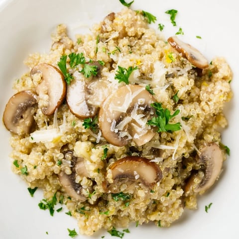 Creamy Mushroom Quinoa Risotto, a comforting vegetarian dish, ready to eat with fresh parsley.