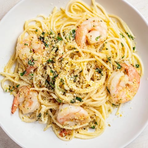 Close-up of Lemon Herb Pasta with Shrimp, showing succulent shrimp and bright lemon zest.