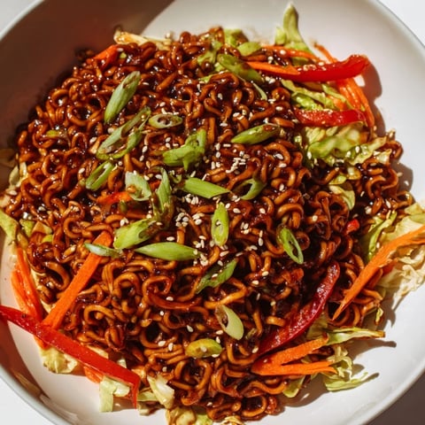 Steaming Spicy Ramen Stir Fry with vibrant vegetables, ready for a delicious Asian-inspired dinner.