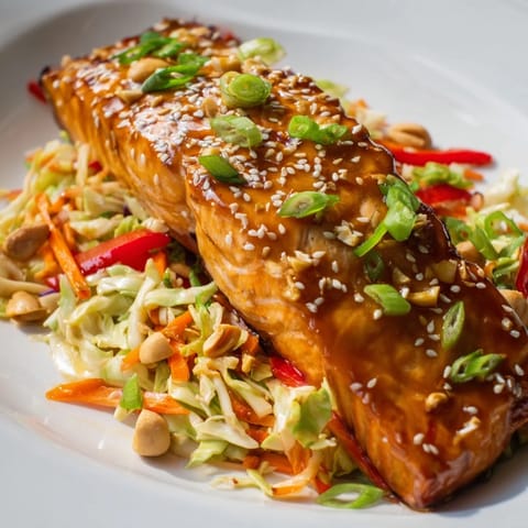 A healthy and delicious Teriyaki Salmon & Asian Slaw Bowl, ready to be enjoyed as a colorful meal.