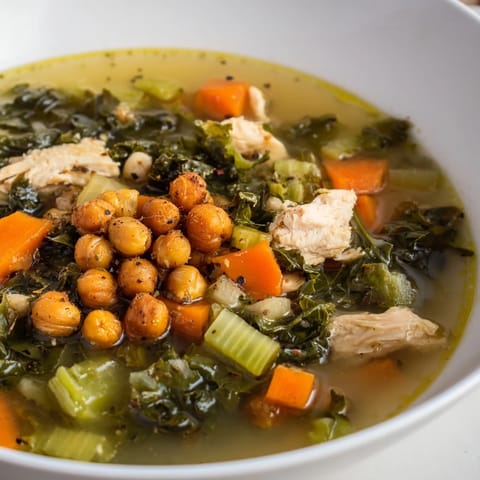Golden, crunchy chickpeas top a vibrant Chicken Kale Soup, ready for a healthy, delicious dinner.