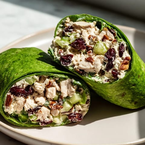 Enjoy a delicious Cranberry Pecan Chicken Salad Christmas Wrap with juicy chicken, perfect for holiday meals.