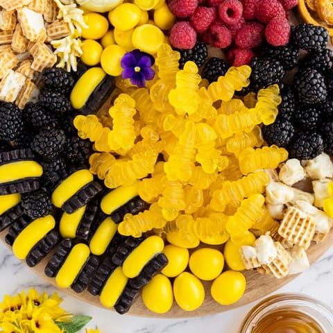 Sweet and playful bumblebee candy board arrangement: a delicious dessert for any spring party.