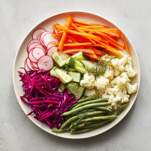 See a beautiful, artfully arranged grid of The Pickled & Fermented Feast with assorted pickled vegetables.