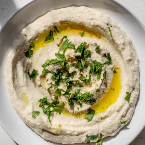 Freshly blended White Bean Dip: a bright, vibrant appetizer with a hint of lemon and garlic.