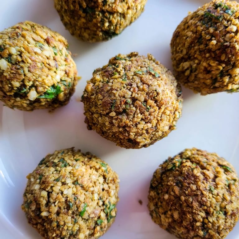 Close-up of flavorful, fried Levantine falafel balls, showcasing their perfectly textured, delicious exterior.