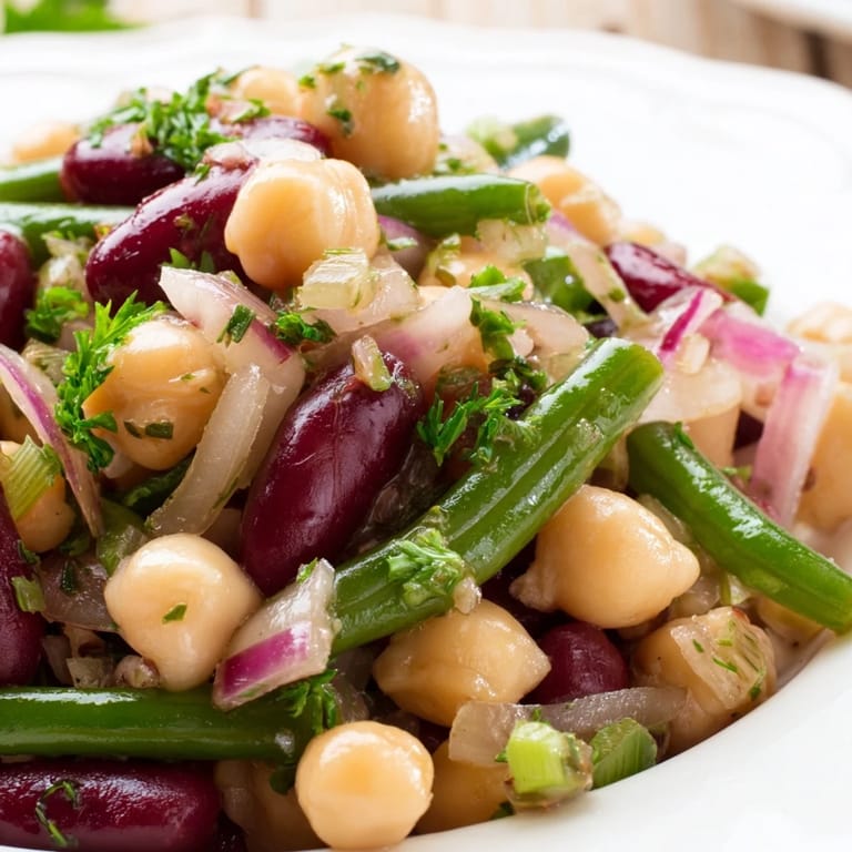 Serving suggestion for Three-Bean Salad: a fresh, gluten-free side dish in a glass bowl, perfect for potlucks and healthy weeknight dinners.