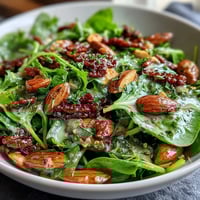 Spring Green Salad with Honey Mustard and Almonds, tossed with crisp snap peas and radishes, drizzled in tangy honey mustard dressing.  